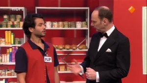 Foto van de presentator van Snugger in gesprek met een man met naamlabeltje met "flip" erop aan zijn kleding.