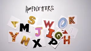 Foto van allerlei soorten hoofdletters bij elkaar, kleurrijk, erboven de tekst "Hoofdletters".