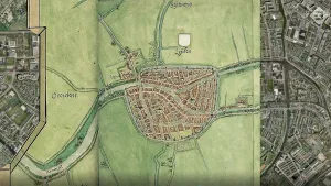 Foto van een oude kaart van een stadje in de weilanden. 