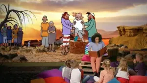 Foto van iemand die voorleest aan kinderen met op de achtergrond een decor uit een bijbelverhaal.