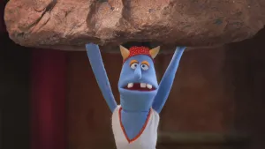 Foto van Stuntman Stefan (pop) die met beide armen een groot rotsblok boven zich houdt.