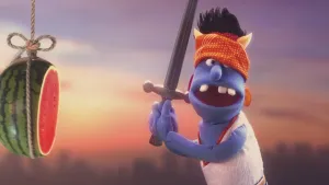 Foto van Stuntman Stefan, pop, die een zwaard draagt en heeft een meloen doorgehakt die aan een touw hangt.