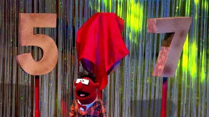 Foto van scène uit de Boterhamshow waarbij Pi R Kwadraat staat voor een vijf, een afgedekte zes en een zeven.