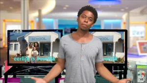 Foto van de rapper Typhoon voor grote TV-schermen in een studio.