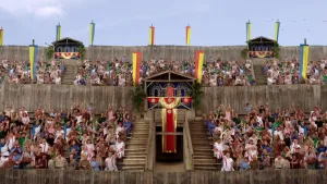 Foto van een amfitheater met vlaggen en versieringen met veel publiek als Romeinen verkleed.