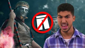 Een foto van Nizar voor een foto van twee mannen verkleed als Romein in een goudkleurig pak en een metalen masker met een rood en groen gestreepte speer in handen. Ervoor staat een tekening van een witte broek met een rode streep erdoor in een rood bord. 