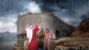 Een foto van de ark van Nuh (Noach) die aan land ligt. Er zijn donkere wolken te zien en het regent. Nuh (Noach) staat voor de ark met zijn handen geheven in de lucht. Naast Nuh (Noach) staan nog drie mensen.