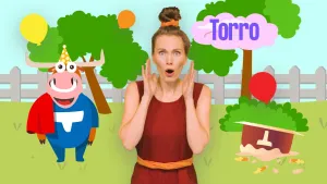 Een foto van presentator Roos die geschrokken kijkt met haar handen naast haar wangen. Rechts staat de tekst 'Torro' en daaronder ligt er een getekende taart op de kop. Links staat er een getekende lachende stier met een rode lap en een feestmuts op. 