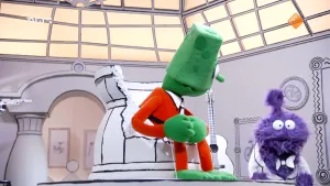 Een foto van twee gekleurde poppen in een zwart-witte kamer. Alle dingen in de kamer hebben zwarte lijntjes, alsof ze getekend zijn. De groene pop zit op een stoel en kijkt naar de paarse pop. 