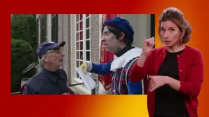 Een foto van een Piet, die een brief krijgt van de postbode. Ze staan voor de deur van het Pietenhuis. Daarnaast een foto van de gebarentolk.