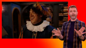 Pietje Paniek staat in het pakjesruim. Gebarentolk staat naast het scherm.