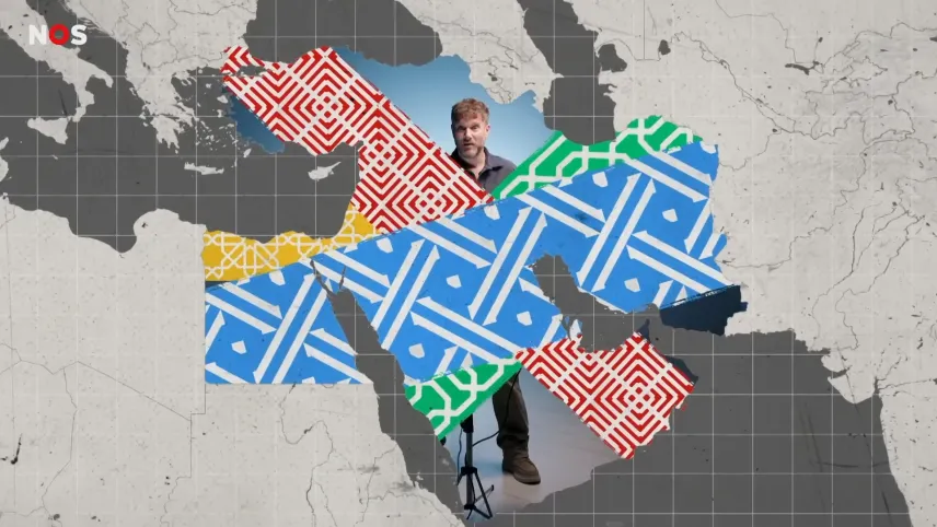 Een samengestelde afbeelding. Een kaart van het Midden-Oosten, willekeurig ingekleurd met verschillende patronen. Sommige delen zijn niet ingevuld, daar is presentator Emil in de studio doorheen te zien.
